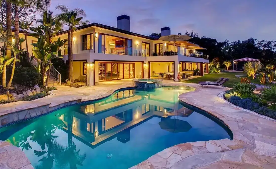 Luxurious home with pool at dusk